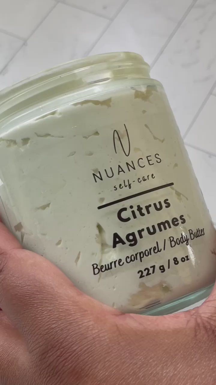 A video showing someone scooping the citrus body butter form the jar